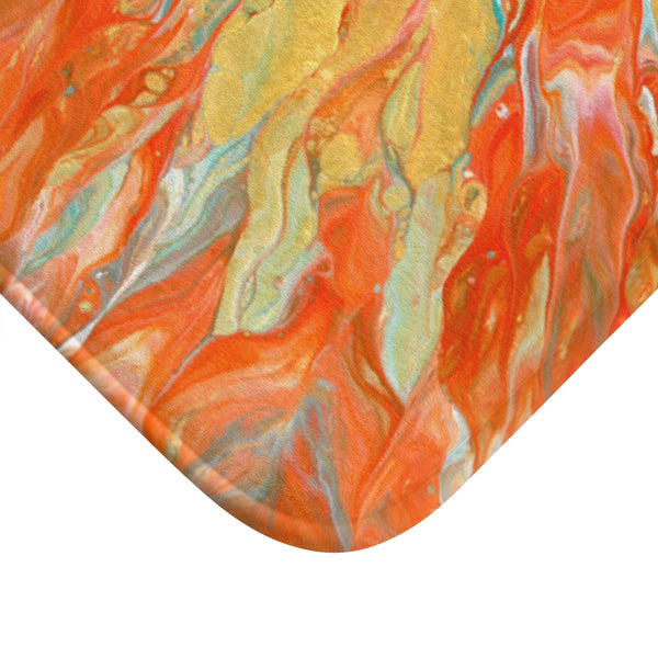 Orange and gold bath mat corner closeup
