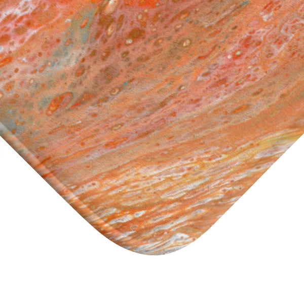 Orange abstract art bath mat corner closeup