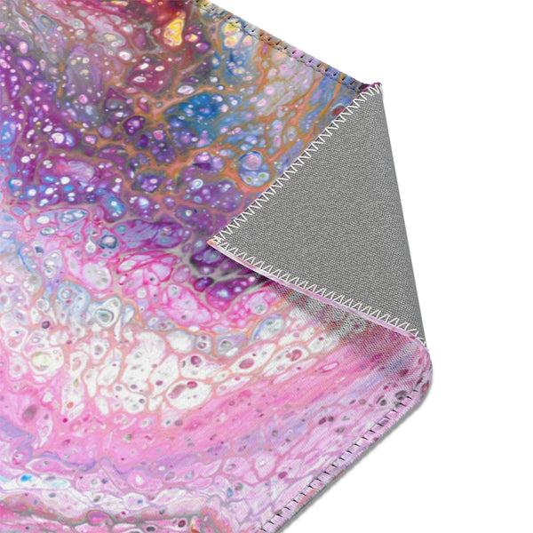 Pink galaxy abstract art area rug corner closeup