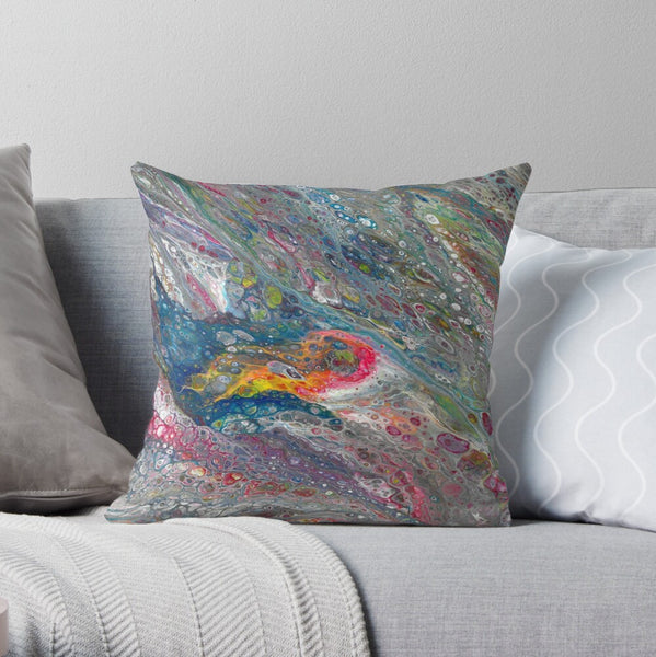 Asteroid abstract pillow on gray couch