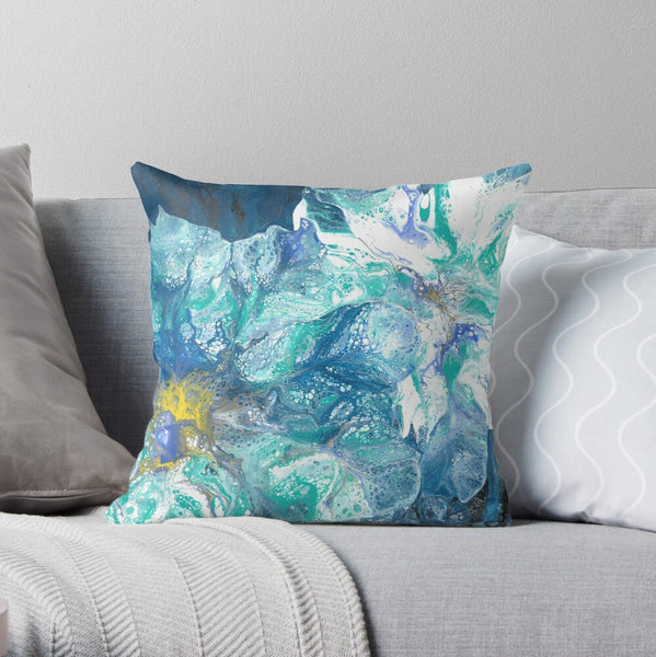 Blue flowers abstract art pillow on gray couch