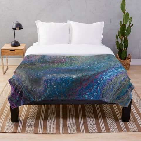 Blue galaxy sherpa fleece blanket on bed