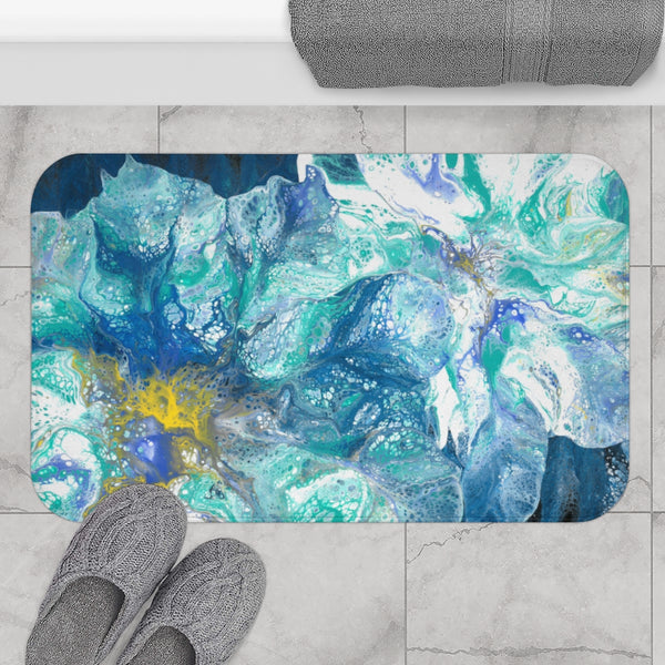 Blue flowers bath mat on gray bathroom floor