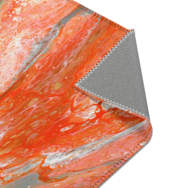 Orange abstract art area rug corner closeup