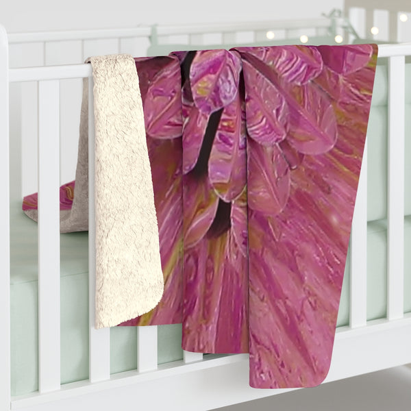 Pink flower sherpa blanket on baby crib